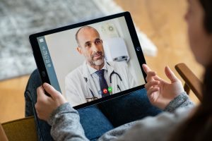 a patient consulting with doctor online